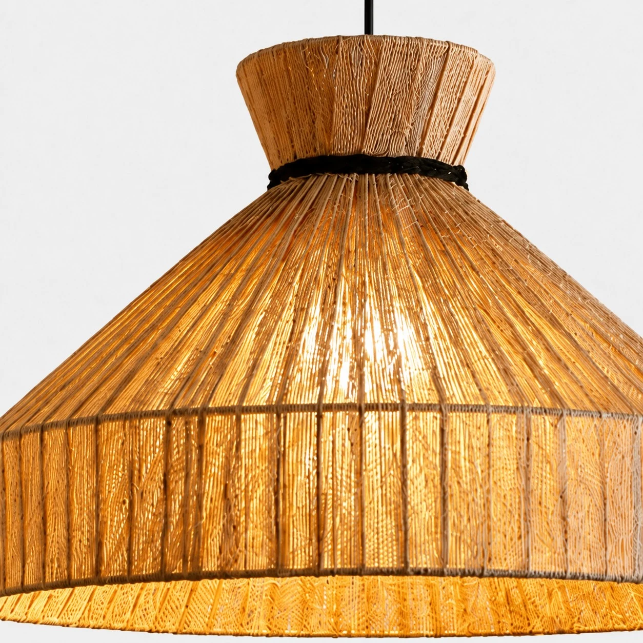 Close-up of woven fabric shade with warm light diffusion