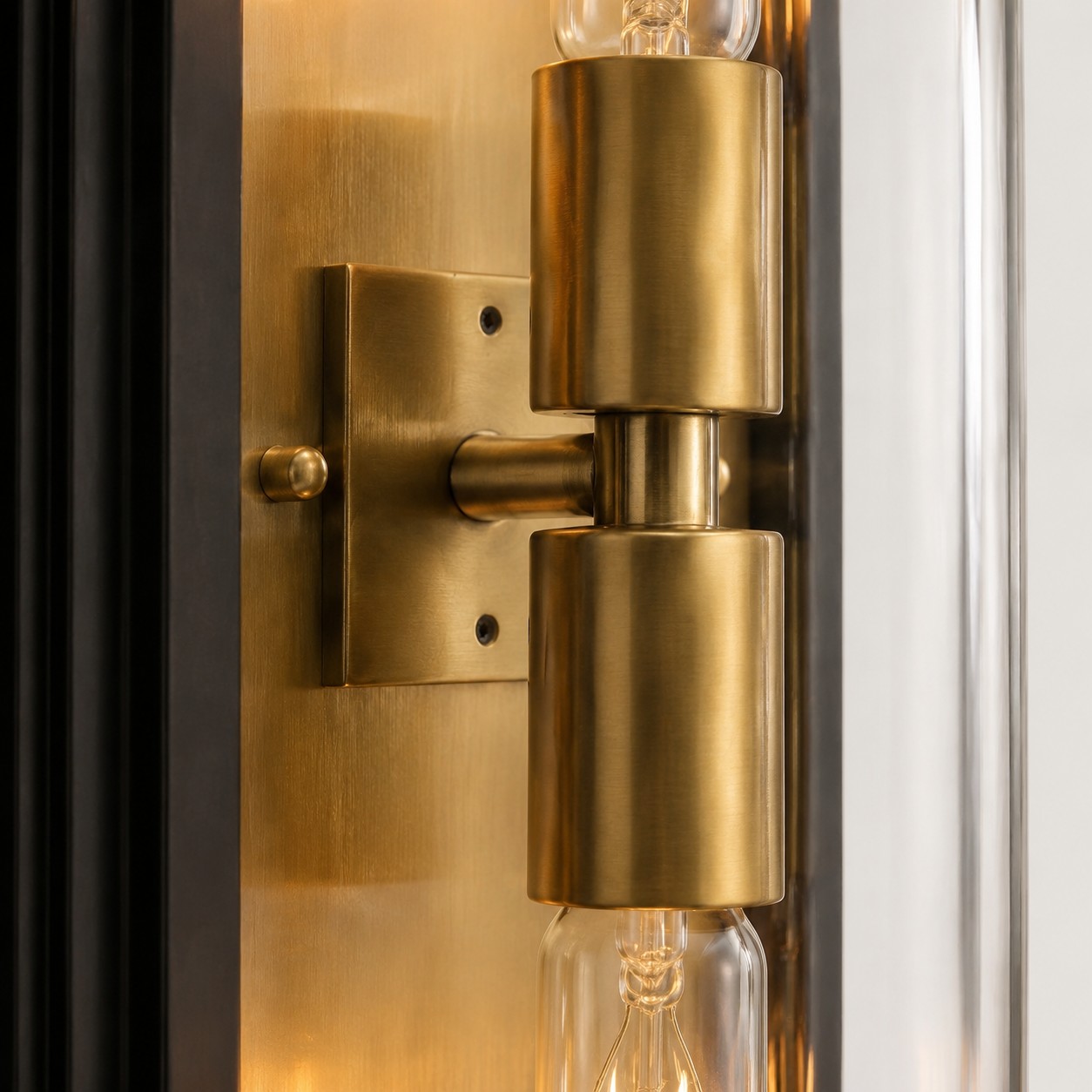 Close view of the brass wall plate and double bulb holder