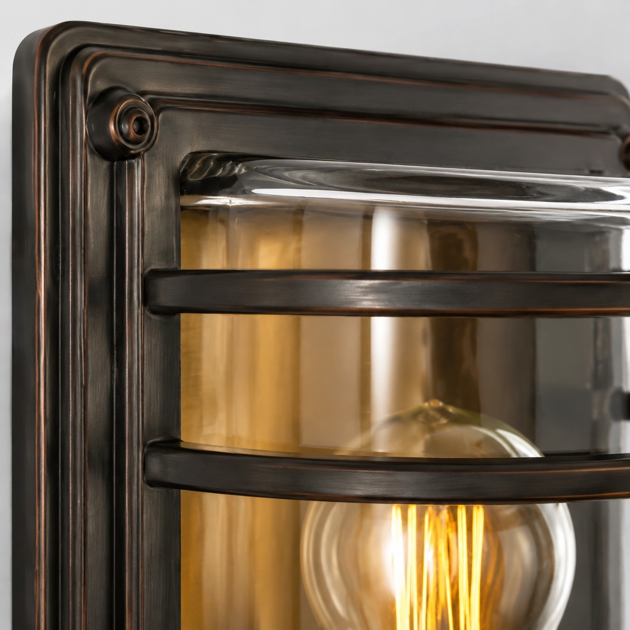 Close view of the bronze top frame and rounded clear glass