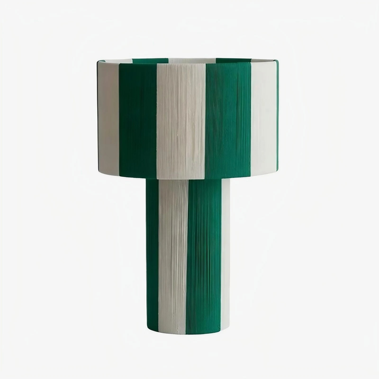 Green and white striped woven shade table lamp on a white background